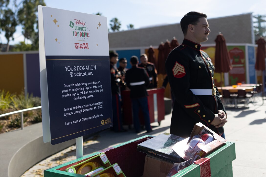 U.S. Marines with 2nd Battalion, 23rd Marine Regiment, 4th Marine Division, Marine Forces Reserve, collect toys, books, and other gifts during Disneyland’s Toys for Tots Drive in Anaheim, California, Dec. 9, 2023. Toys for Tots is a year-round charity that provides toys, books, and games to economically disadvantaged children and families since 1947. (U.S. Marine Corps photo by Lance Cpl. Samantha Devine)