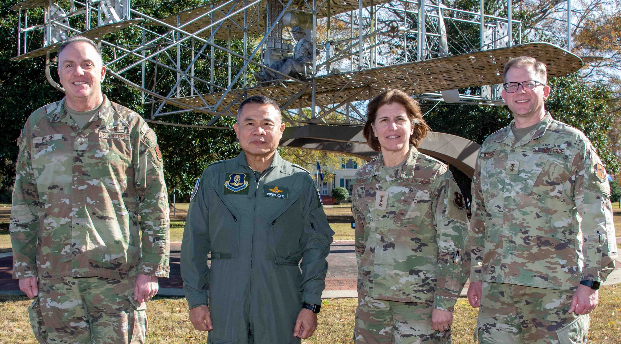 Royal Thai Air Force Commander-in-Chief Air Marshal Punpakdee Pattanakul (second from left) made his first visit to Air University and Maxwell Air Force Base, Alabama, Dec. 12, 2023, since assuming his position in October 2023. His visit was a continuation of the Chief of Staff of the Air Force Counterpart Visits. The visits facilitate key leader engagements and highlight the service’s units, organizations and installations. Pictured with Punpakdee are Lt. Gen. Andrea Tullos (third from left), Air University commander and president; Maj. Gen. Parker Wright (far right), Air University deputy commander, and commander, Curtis E. LeMay Center for Doctrine Development and Education; and escorting general officer Brig. Gen. Gent Welsh, assistant adjutant general and commander Washington Air National Guard, Camp Murray, Washington.