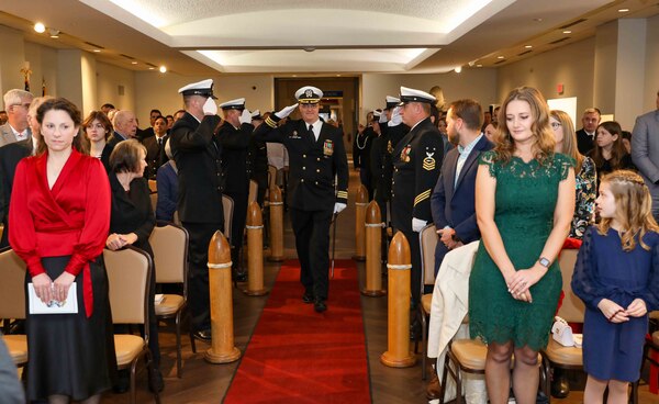 Cmdr. Vincent Kahnke, commanding officer of the Pre-Commissioning Unit (PCU) Arkansas (SSN 800), salutes sideboys during the boat’s change of command ceremony at the Mariners’ Museum and Park in Newport News, Virginia.