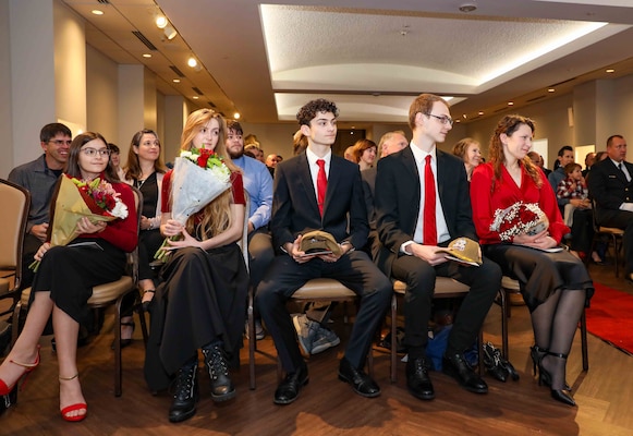 The family of Cmdr. Vincent Kahnke, commanding officer of the Pre-Commissioning Unit (PCU) Arkansas (SSN 800), sit in attendance during the boat’s change of command ceremony at the Mariners’ Museum and Park in Newport News, Virginia.