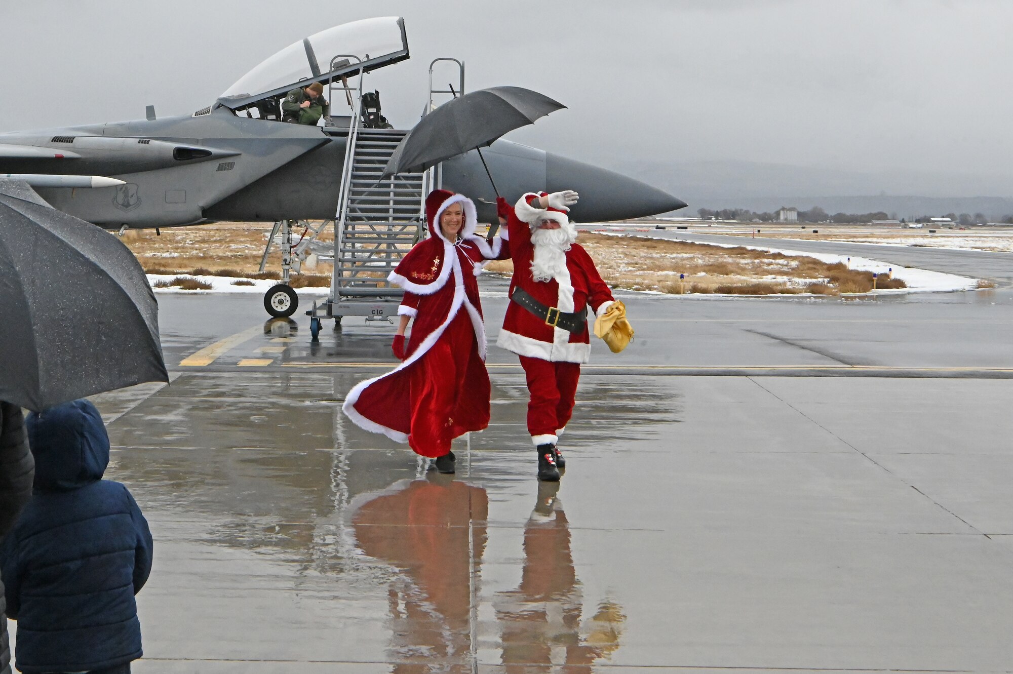 Santa and Mrs. Claus wave to the crowd of 173rd Fighter Wing Airmen and their families during the annual Children’s Christmas Festival, December 2, 2023, at Kingsley Field in Klamath Falls, Oregon.