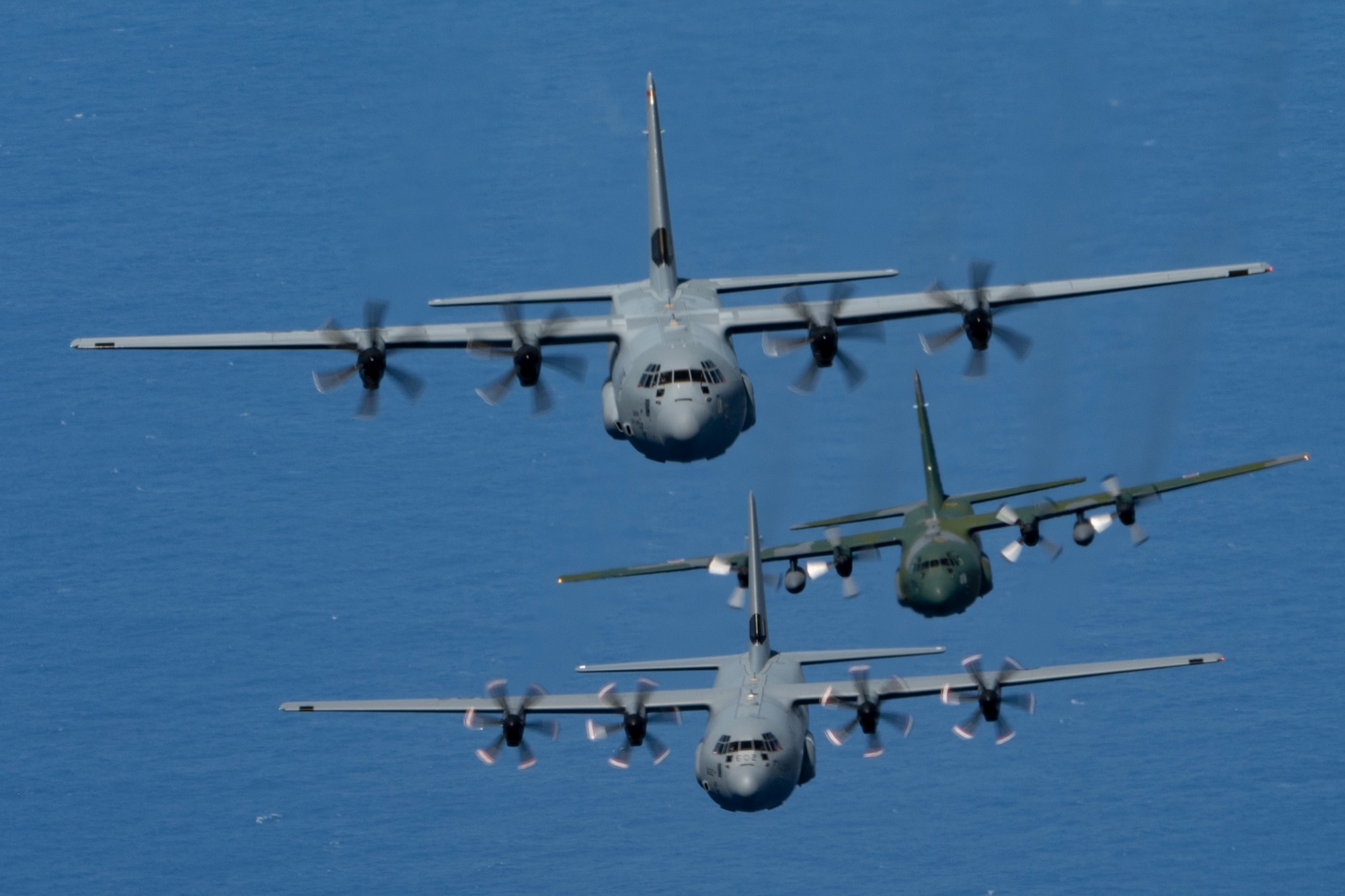 Photo of Cargo aircraft from Japan, U.S., Canada, and the Republic of Korea flying together over the Pacific.