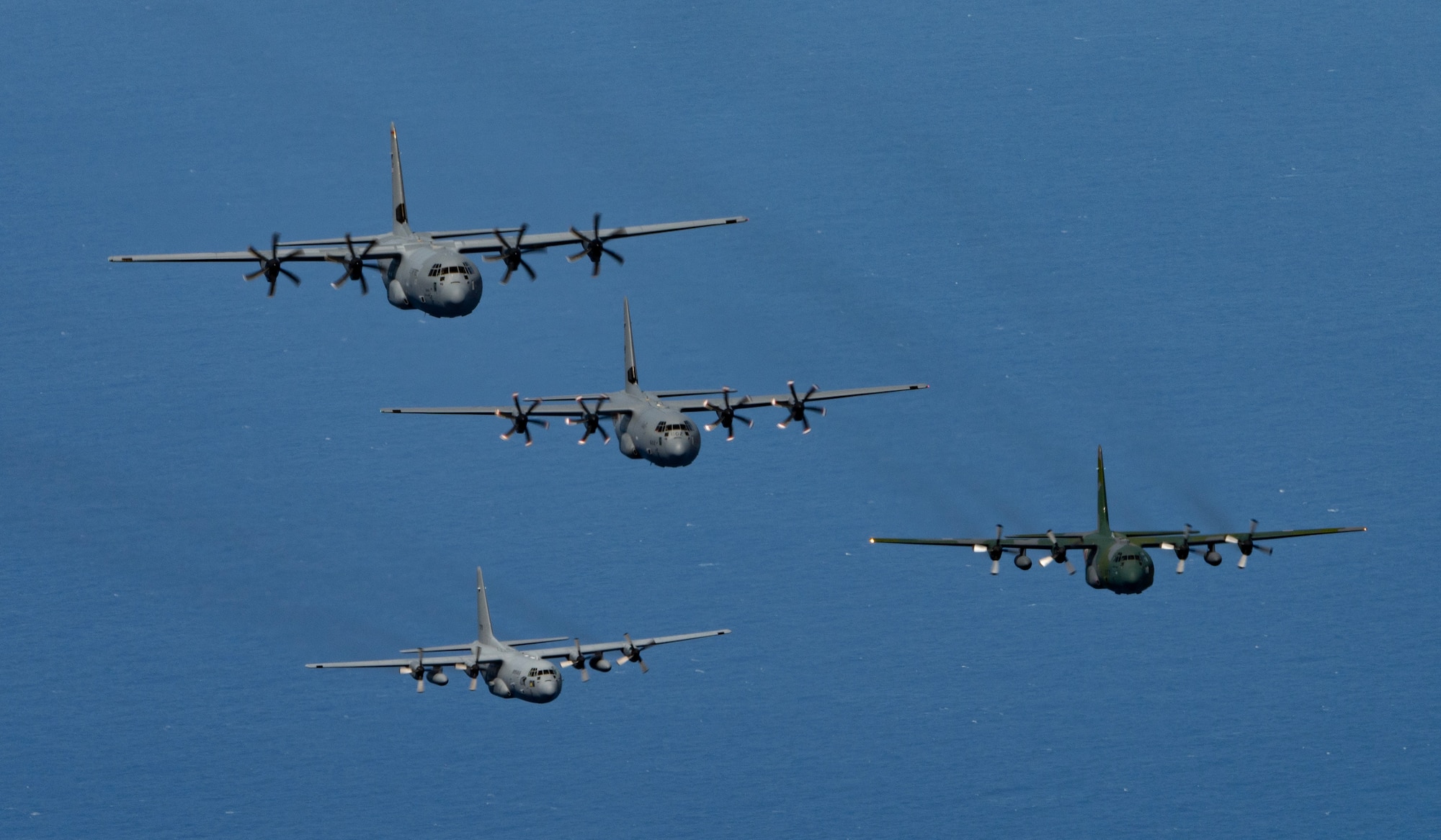 Photo of Cargo aircraft from Japan, U.S., Canada, and the Republic of Korea flying together over the Pacific.