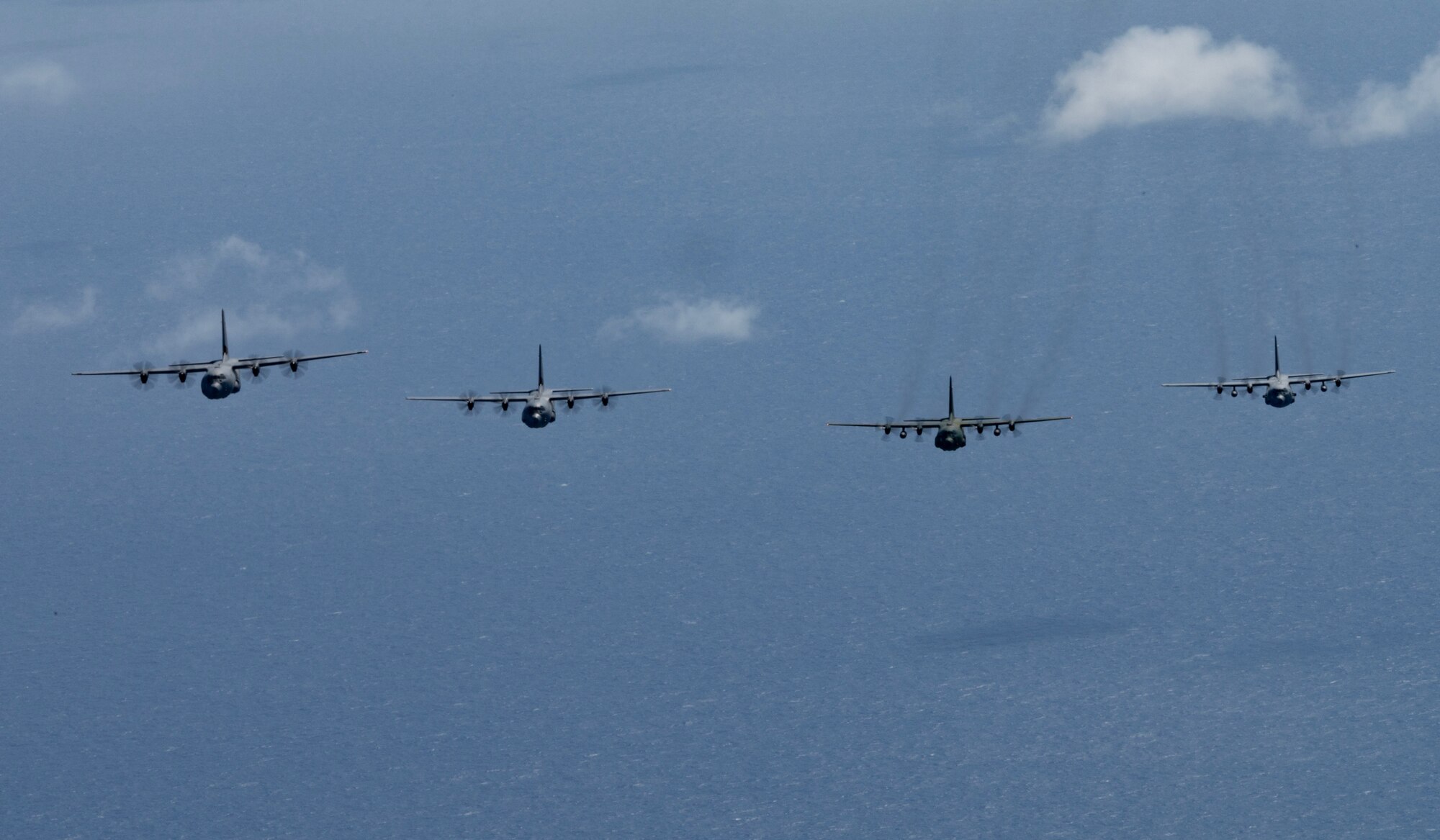 Photo of Cargo aircraft from Japan, U.S., Canada, and the Republic of Korea flying together over the Pacific.