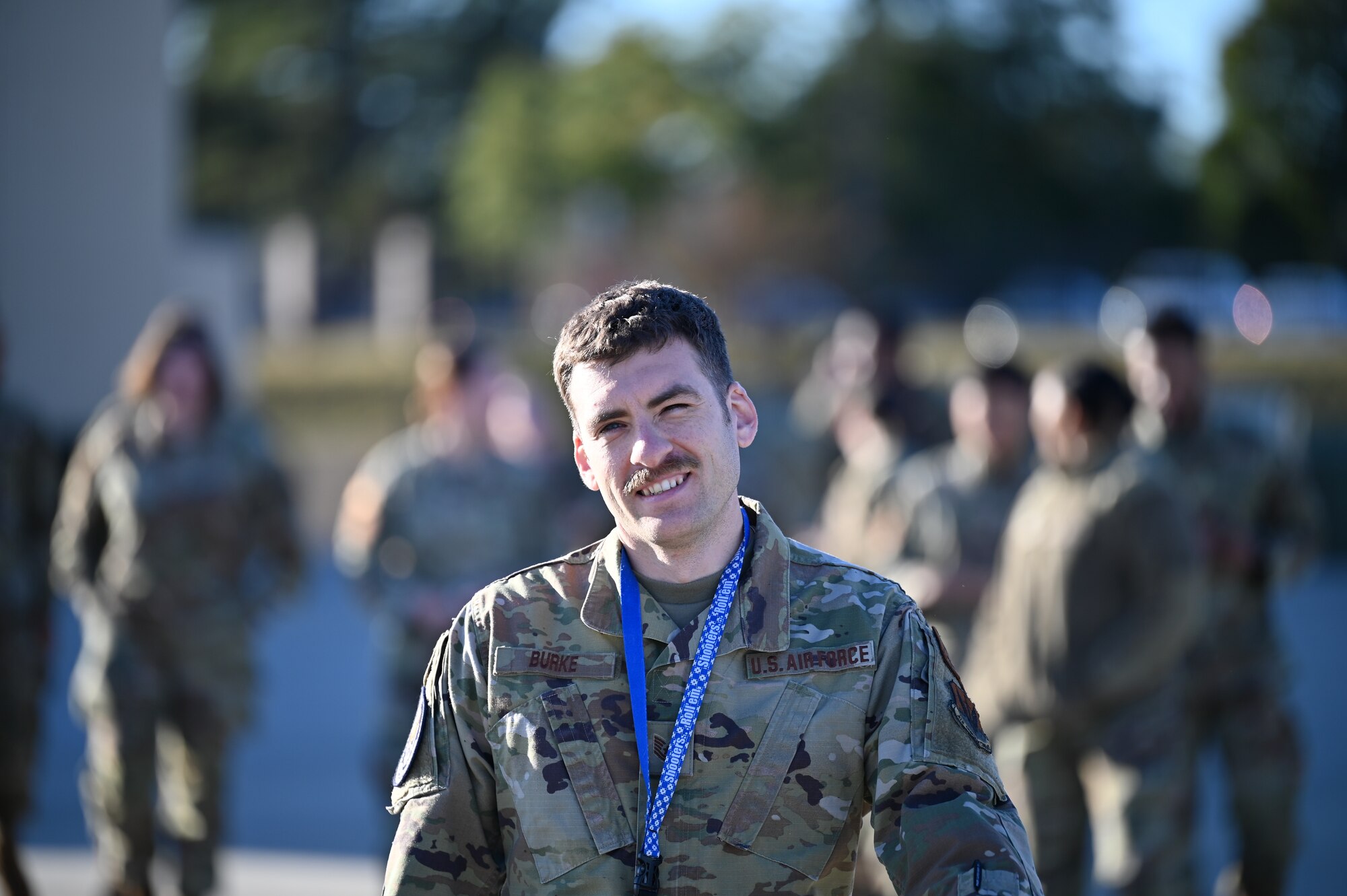Man looks into camera while walking
