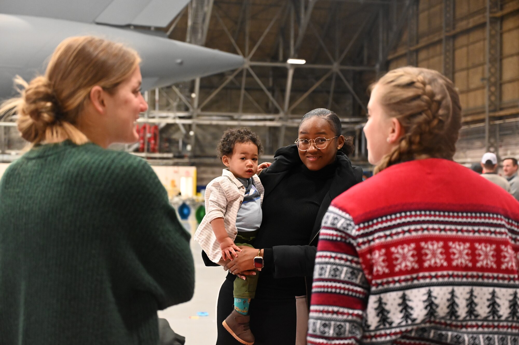 Service members and their families enjoyed a variety of festive activities including arts and crafts, a bouncy house, pictures with Santa and complimentary food during the event.