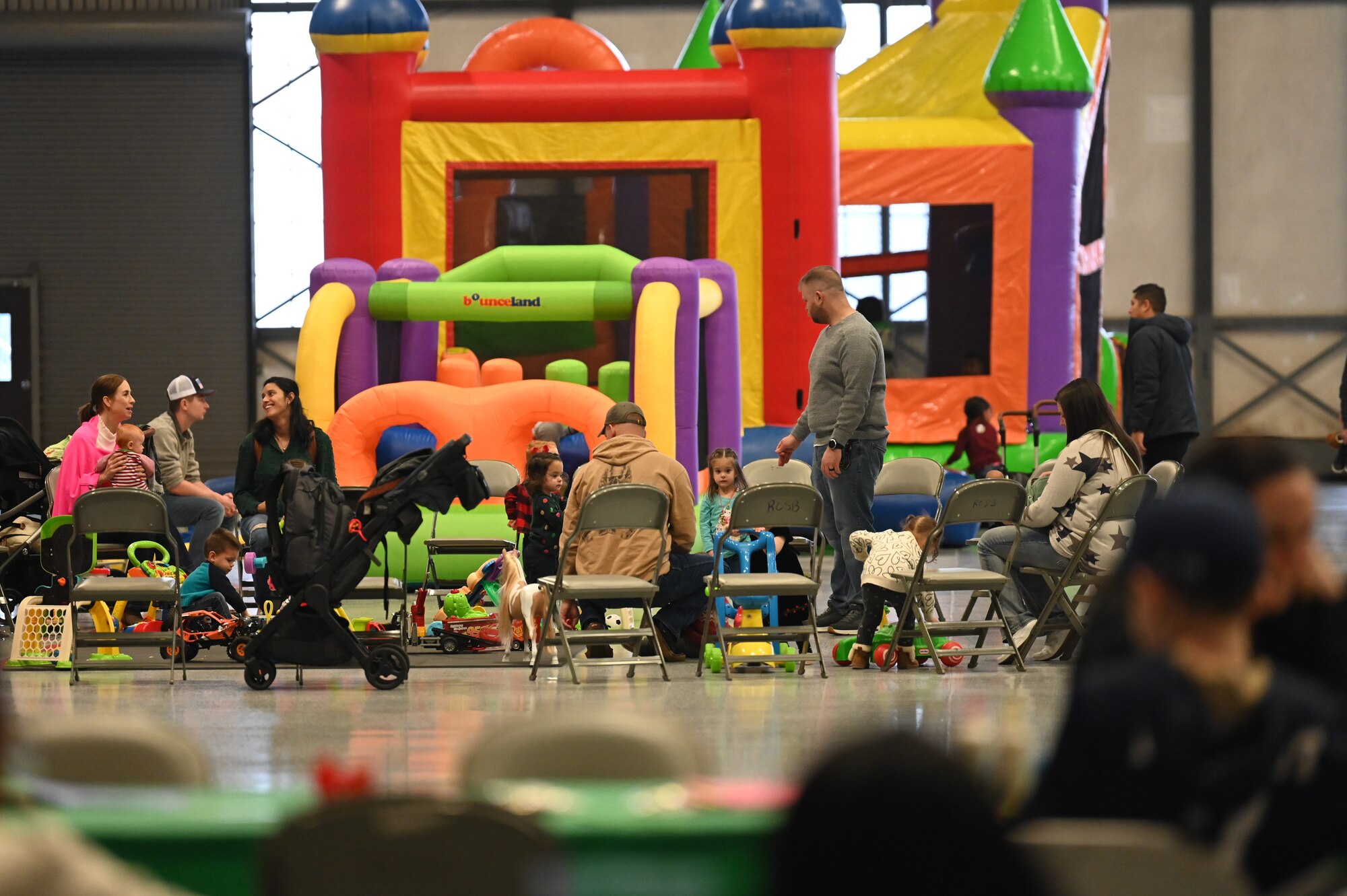 Service members and their families enjoyed a variety of festive activities including arts and crafts, a bouncy house, pictures with Santa and complimentary food during the event.