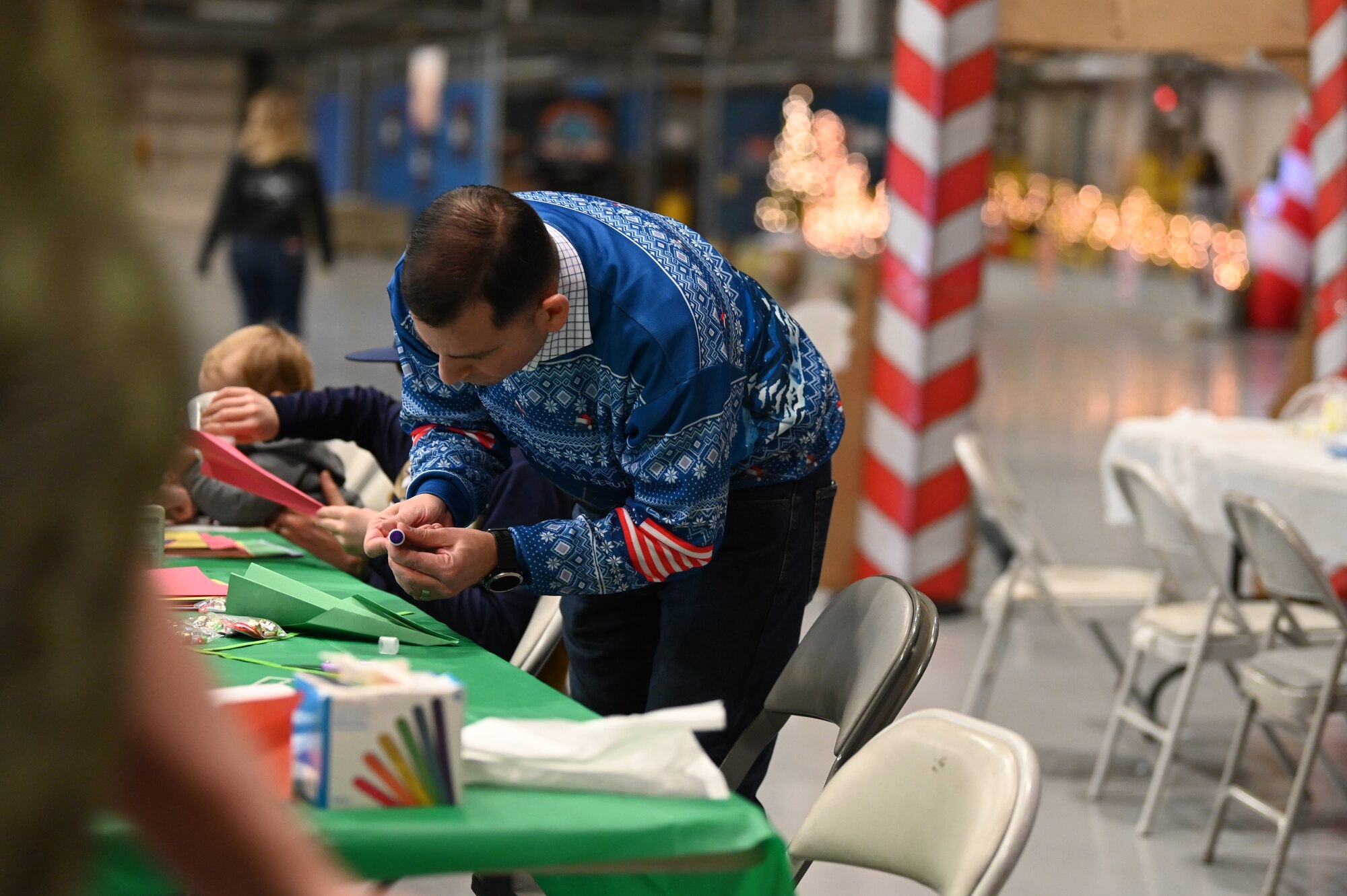 Service members and their families enjoyed a variety of festive activities including arts and crafts, a bouncy house, pictures with Santa and complimentary food during the event.