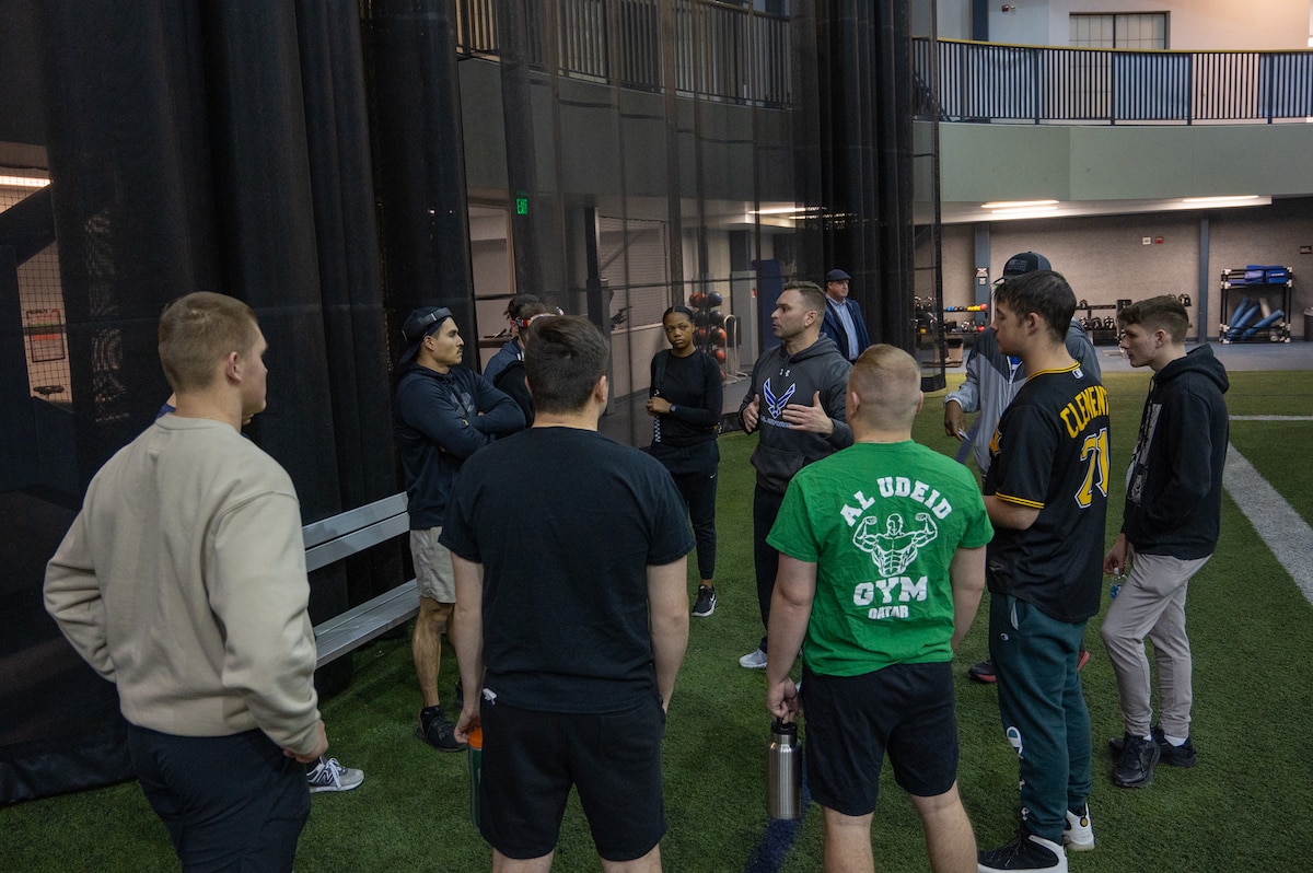 U.S. Air Force Maj. Miles Stutes, 354th Medical Group Operational Support Team physical therapist, explains the workout plan during group physical training.