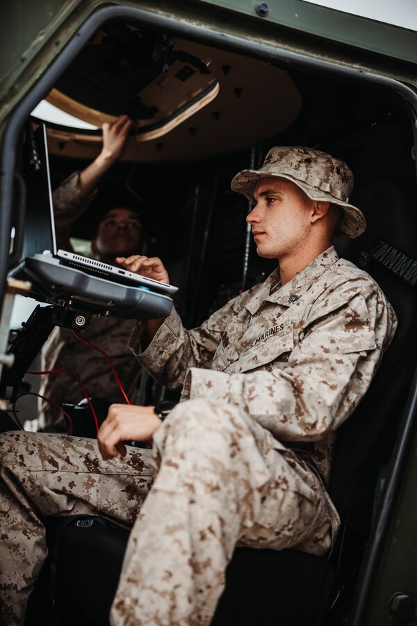 U.S. Marine Corps Cpl. Jeremy Allen, a Highland, California native, network administrator with Headquarters Battalion, 3d Marine Division, uses a computer during an Expeditionary Communications Course at Marine Corps Air-Ground Combat Center, Twentynine Palms, California, Nov. 15, 2023. ECC trains Marines in expeditionary skillsets that enable them to operate in any environment across the full range of military operations. (U.S. Marine Corps photo by Lance Cpl. Richard PerezGarcia)