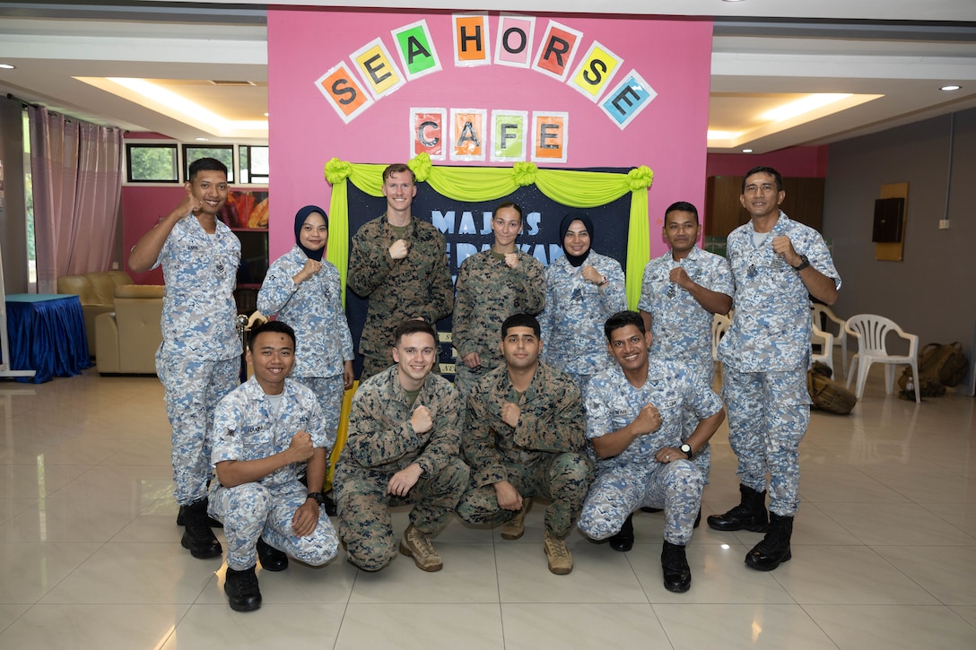 U.S. Marines with Marine Rotational Force-Southeast Asia, I Marine Expeditionary Force and Royal Malaysian Navy sailors with Western Fleet Command pose for a photo after the opening ceremony for Maritime Training Activity Malaysia onboard RMN Lumut Naval Base, Lumut, Malaysia, Nov. 1, 2023. The ceremony marked the beginning of MTA Malaysia and was attended by sailors from the Royal Malaysian Navy, U.S. Navy, and U.S. Marines. Maritime Training Activity Malaysia 2023 highlights the 4th iteration of the series as one of many exercises that allow the U.S. and Royal Malaysian navies to work together, enhancing maritime security and capabilities in the full range of maritime warfare. MRF-SEA is a Marine Corps Forces Pacific operational model, which involves planned exchanges with subject matter experts, promotes security goals with Allies and partners and positions I MEF forces west of the International Date Line. (U.S. Marine Corps photo by Staff Sgt. Kai W. Huber)