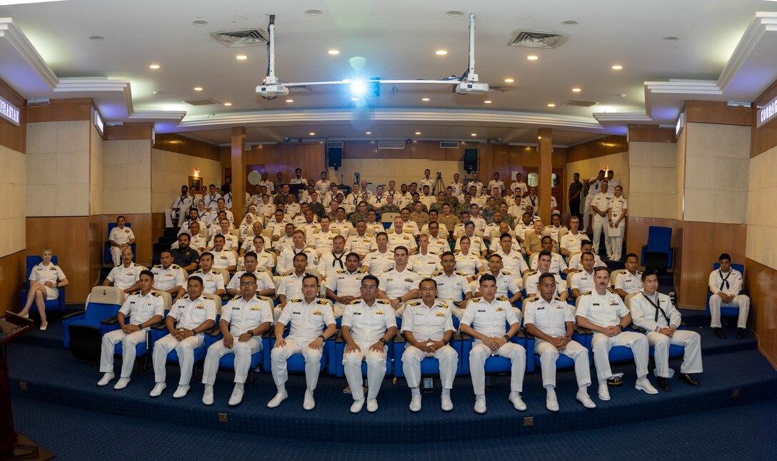 U.S. Navy Sailors assigned to Independence-variant littoral combat ship USS Manchester (LCS 14), Destroyer Squadron 7, and U.S. 7th Fleet, U.S. Marines with Marine Rotational Force-Southeast Asia, I Marine Expeditionary Force, and Royal Malaysian Navy Sailors with Western Fleet Command pose for a photo during the opening ceremony of Maritime Training Activity Malaysia onboard Lumut Naval Base, Lumut, Malaysia, Nov. 1, 2023. The ceremony marked the beginning of MTA Malaysia and was attended by sailors from the Royal Malaysian Navy, U.S. Navy and U.S. Marines. MTA Malaysia 2023 highlights the 4th iteration of this series as one of many exercises that allow the U.S. and Royal Malaysian navies to work together, enhancing maritime security and capabilities in the full range of maritime warfare. MRF-SEA is a Marine Corps Forces Pacific operational model, which involves planned exchanges with subject matter experts, promotes security goals with Allies and partners and positions I MEF forces west of the International Date Line. (U.S. Marine Corps photo by Staff Sgt. Kai W. Huber)