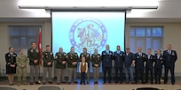 Award recipients (or designees, in their absence) stand front and center at the New Hampshire National Guard’s annual awards ceremony on Dec. 13, 2023, at the Edward Cross Training Complex in Pembroke, N.H.