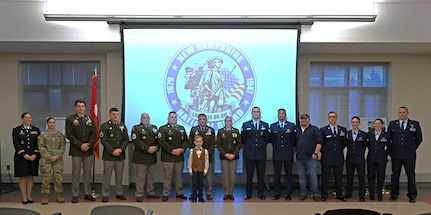Award recipients (or designees, in their absence) stand front and center at the New Hampshire National Guard’s annual awards ceremony on Dec. 13, 2023, at the Edward Cross Training Complex in Pembroke, N.H.