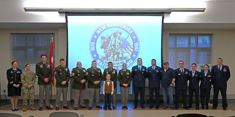 Award recipients (or designees, in their absence) stand front and center at the New Hampshire National Guard’s annual awards ceremony on Dec. 13, 2023, at the Edward Cross Training Complex in Pembroke, N.H.