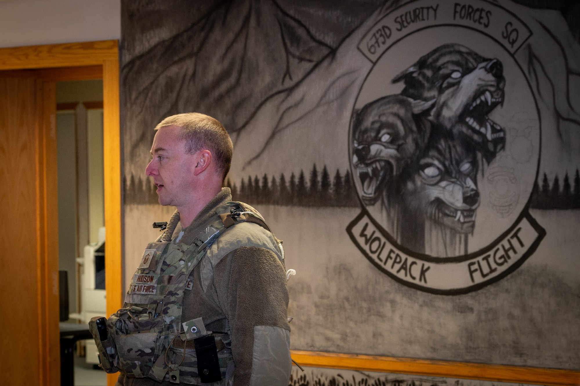 U.S. Air Force Master Sgt. Rian Hudson, a flight chief assigned to 673rd Security Forces Squadron, addresses his flight during a guard mount on Joint Base Elmendorf-Richardson, Alaska, Nov. 19, 2023.