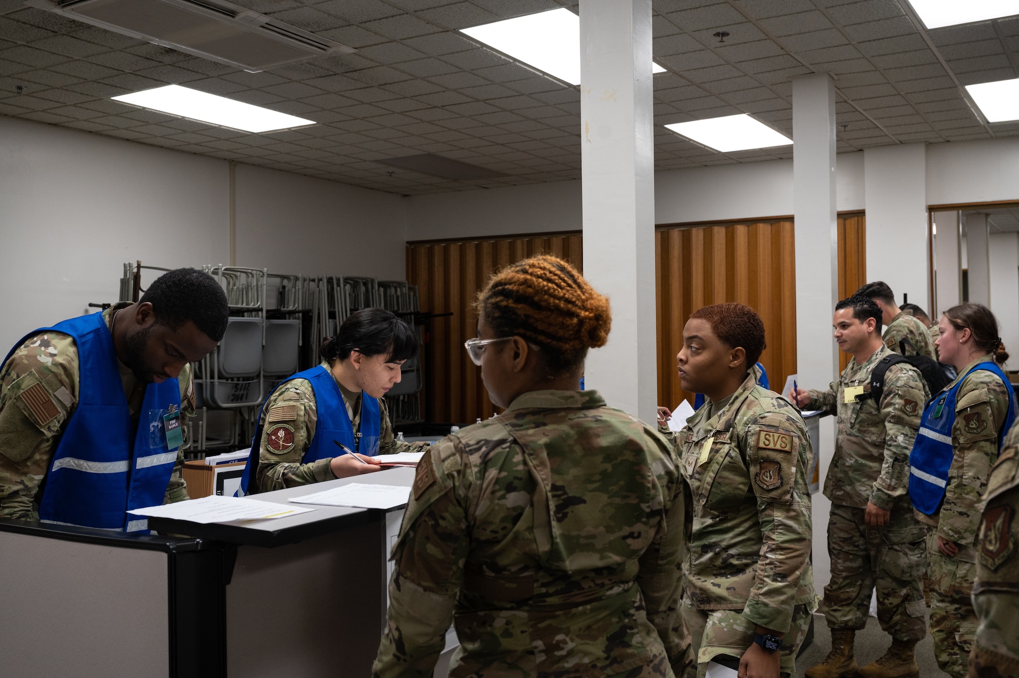 647th Force Support Squadron check deployers through a pre-deployment function line during the Readiness Exercise 24-01 at JBPHH, Hawaii, Dec. 12, 2023. The 15th Wing’s ability to surge combat-ready forces across the theater is critical to supporting regional alliances, partnerships and stability. (U.S. Air Force photo by Staff Sgt. Alan Ricker)