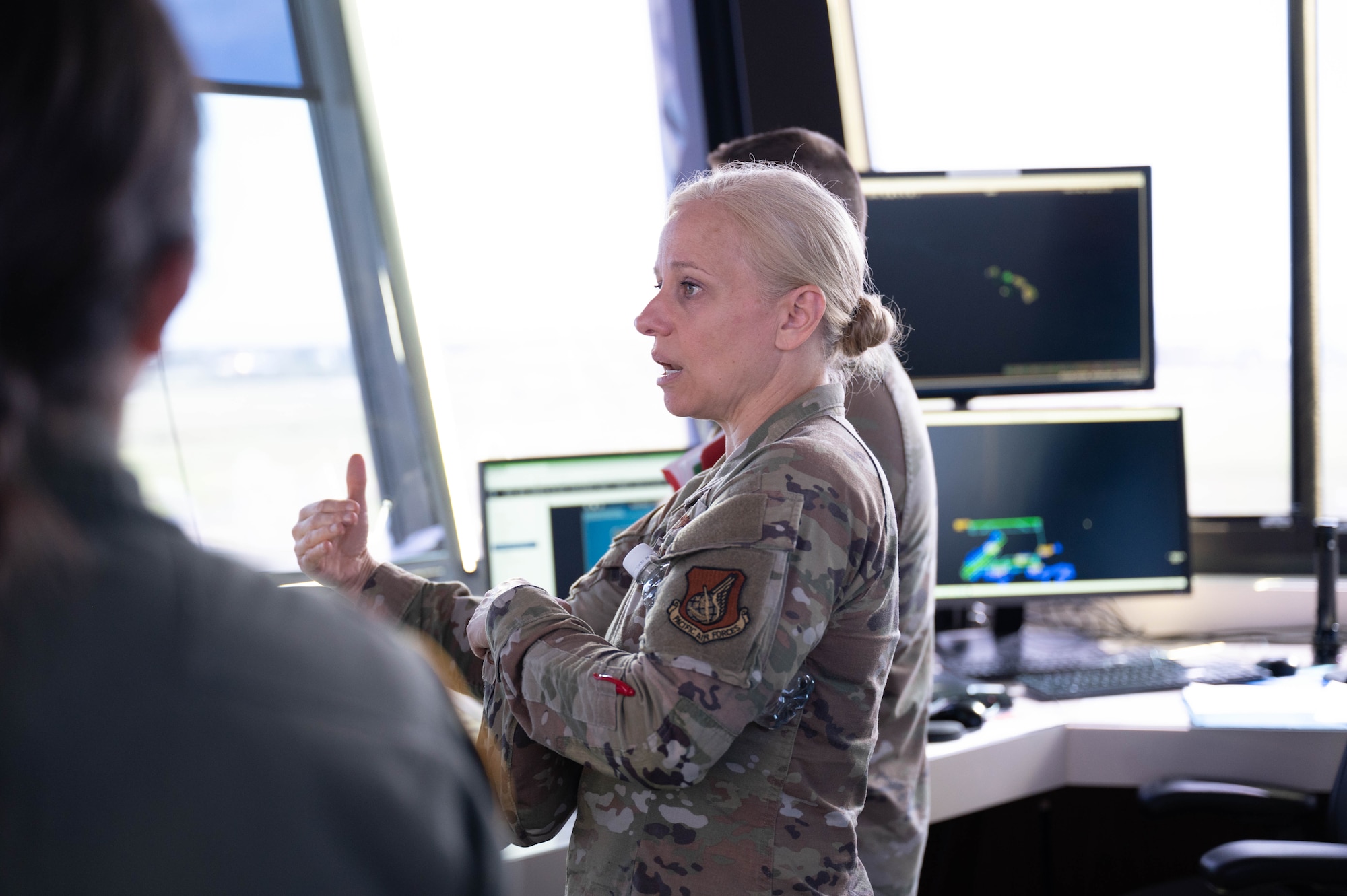 U.S. Air Force Col. Michele Lo Bianco, 15th Wing commander, speaks on the unique mission of the 15th Wing during a tour at Joint Base Pearl Harbor-Hickam, Hawaii, Dec. 7, 2023. Lo Bianco discussed the 15th Wing’s role and ability to enable, employ and project combat power across the Indo-Pacific theater. (U.S. Air Force photo by 2nd Lt. Margaret Blice)