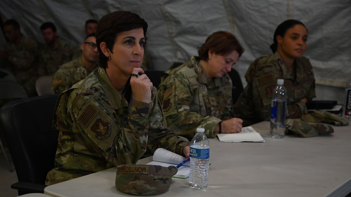 U.S. Air Force Chief Master Sgt. Kristina Montgomery, 2nd Air Force command chief, is briefed on the mission of Joint All Domain Exercise Forward Operations Readiness Generation Exercise at Goodfellow Air Force Base, Texas, Dec. 8, 2023. JADE FORGE is a simulated joint deployment area that provides a training environment for intelligence, surveillance and reconnaissance students. (U.S. Air Force photo by Airman 1st Class Evelyn D’Errico)