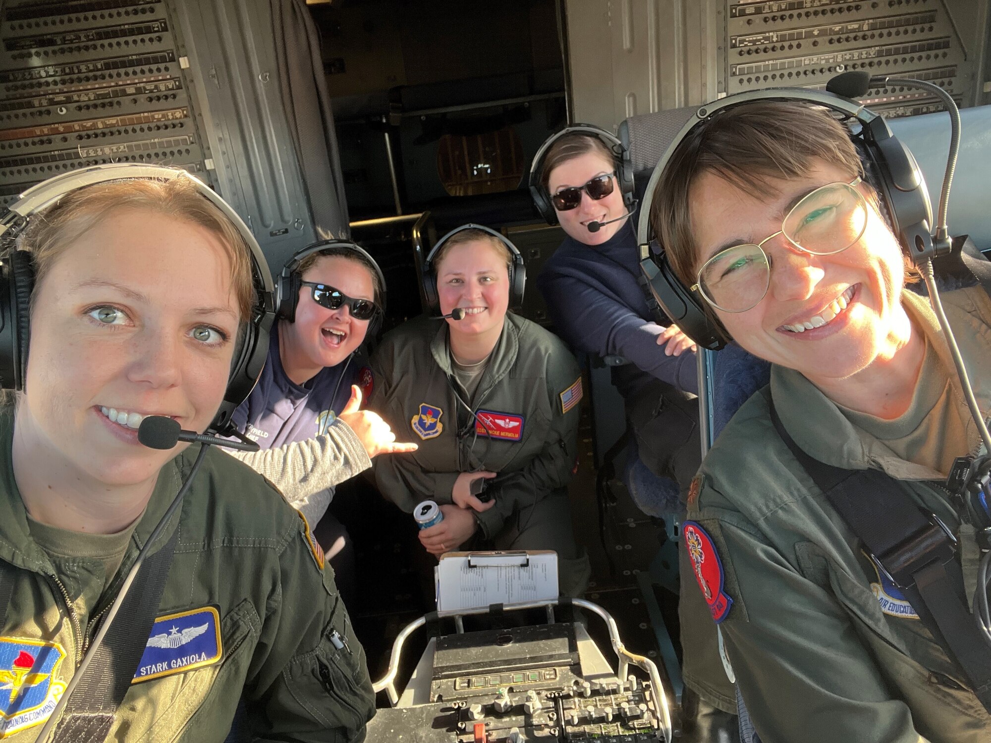 97th Air Mobility Wing Aircrew take a selfie photo in a C-17 Globemaster III at the 2023 Oklahoma Women in Aviation and Aerospace event held at Will Rogers Air National Guard Air Base, Oklahoma, Dec. 8, 2023. The Aircrew flew a C-17 from Altus Air Force Base to the event to showcase a static display for local students to experience. (Courtesy photo by U.S. Air Force Maj. Megan Edson)