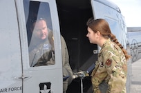 two people conduct preflight checks