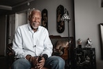 Retired World War II veteran sitting in his home