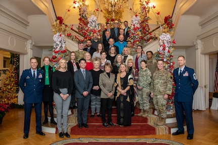 Civic leaders and military personnel from Cannon Air Force Base, New Mexico, join 42d Air Base Wing Commander Col. Ryan Richardson and Command Chief Master Sgt. Caleb Vaden from Maxwell Air Force Base, Ala., for a group photo