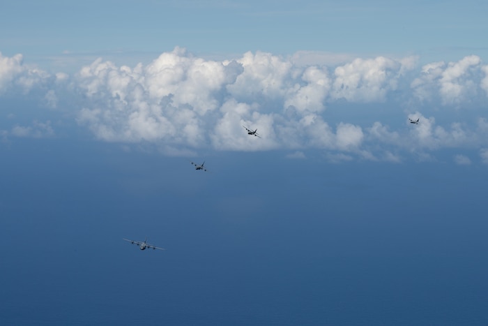 Photo of Cargo aircraft from Japan, U.S., Canada, and the Republic of Korea flying together over the Pacific.