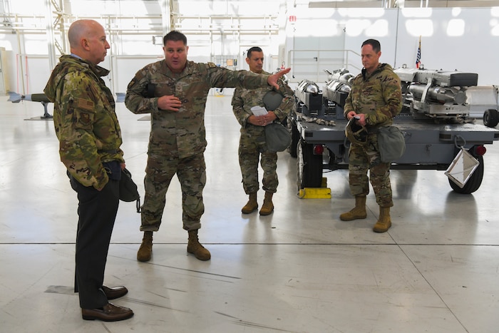 U.S. Air Force Airmen speaks in hangar