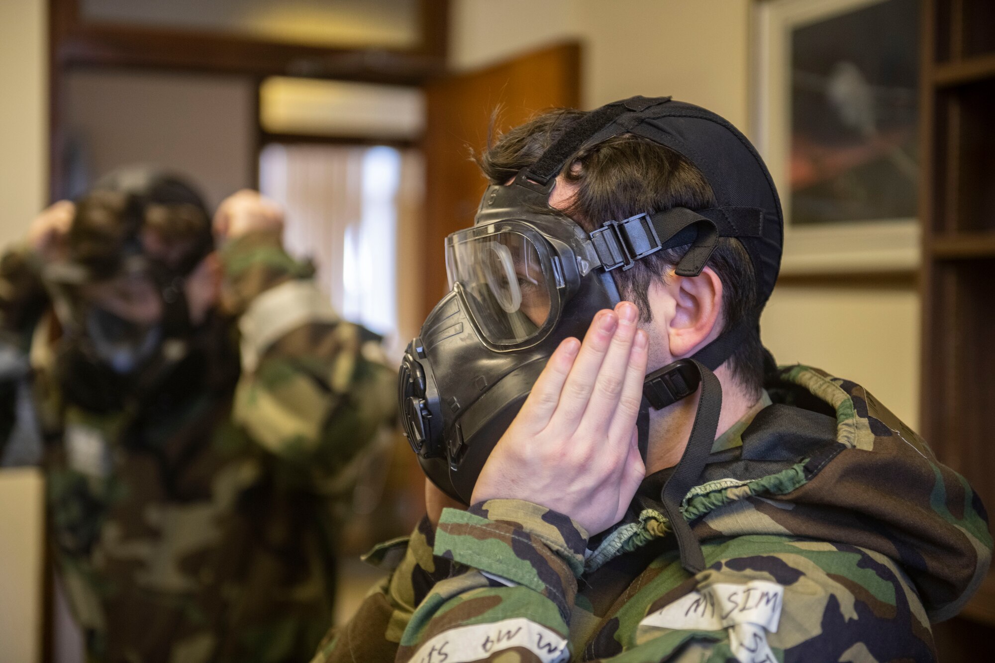 Airmen from the 422d Communications Squadron participate in chemical, biological, radiological and nuclear defense training at RAF Barford St. John
