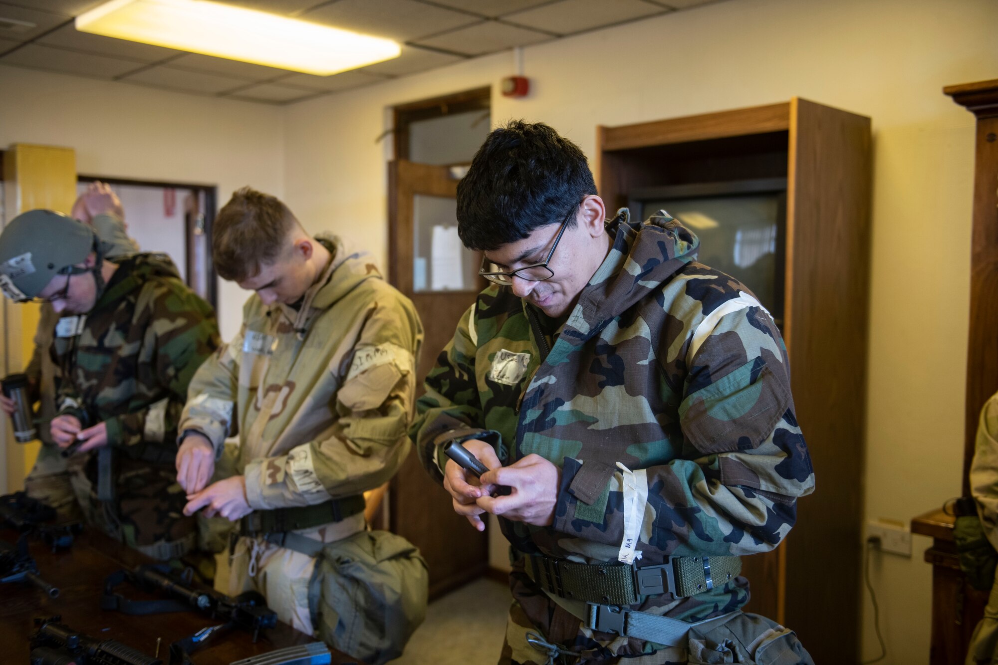 Airmen from the 422d Communications Squadron participate in weapons familiarization training at RAF Barford St. John