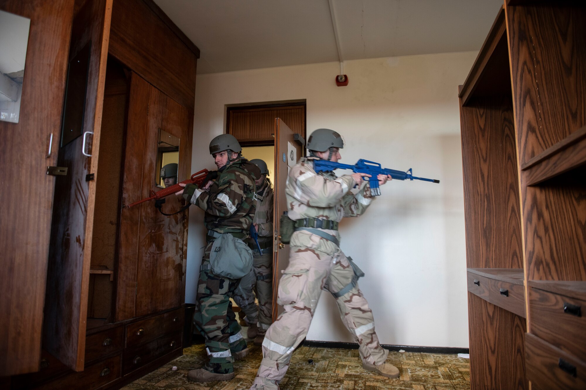 Airmen from the 422d Communications Squadron practice room clearing operations at RAF Barford St. John