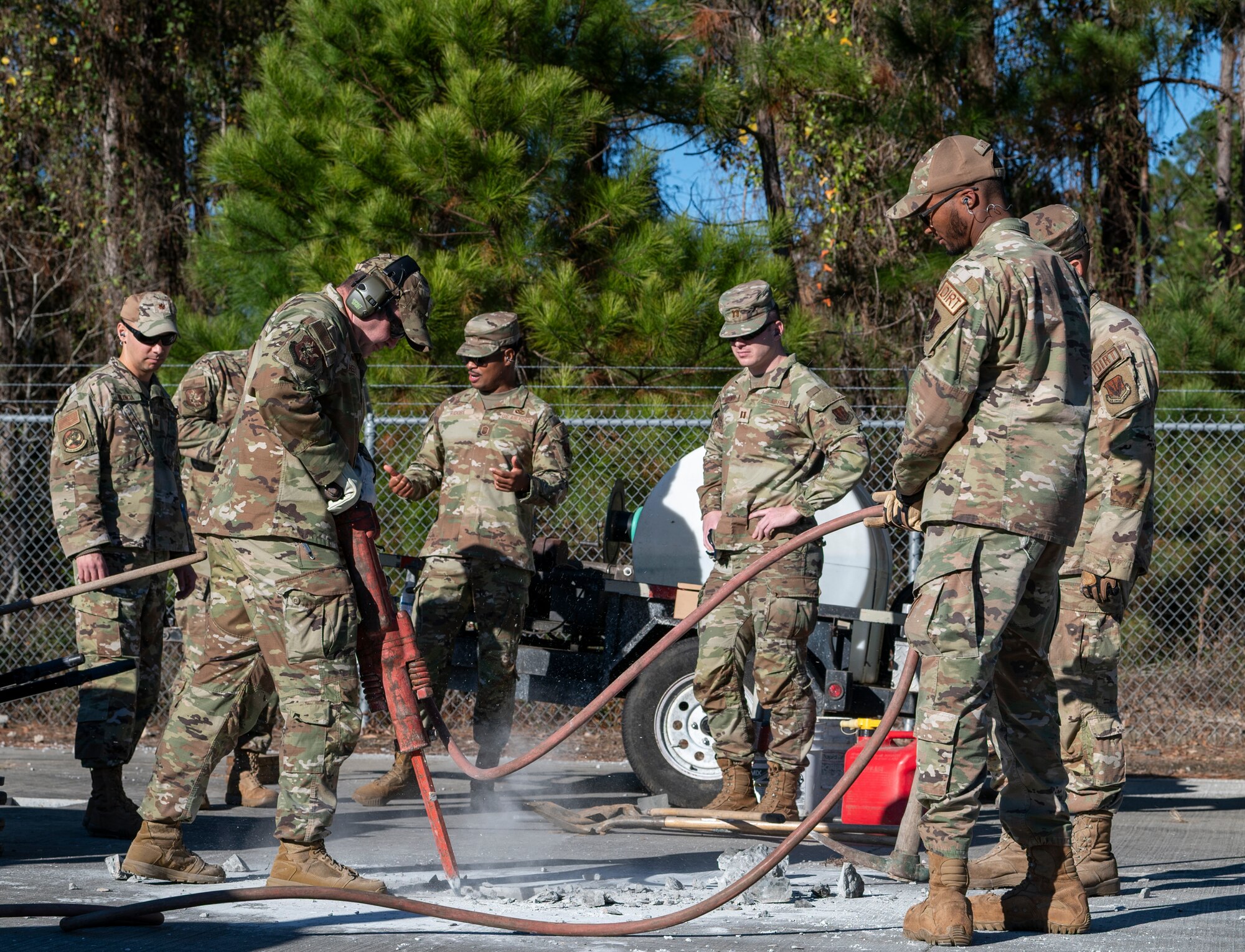 U.S. Air Force Col. Paul Sheets, 23rd Wing commander, operates a jackhammer during a battlefield circulation