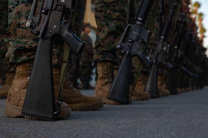 U.S. Marines with Lima Company, 3rd Recruit Training Battalion, participate in a battalion commander's inspection at Marine Corps Recruit Depot San Diego, Dec.13, 2023. The battalion commander’s inspection surveys new Marines knowledge, bearing, and attention to detail as one of their last tests before graduating. (U.S. Marine Corps photo by Lance Cpl. Sarah M. Grawcock)