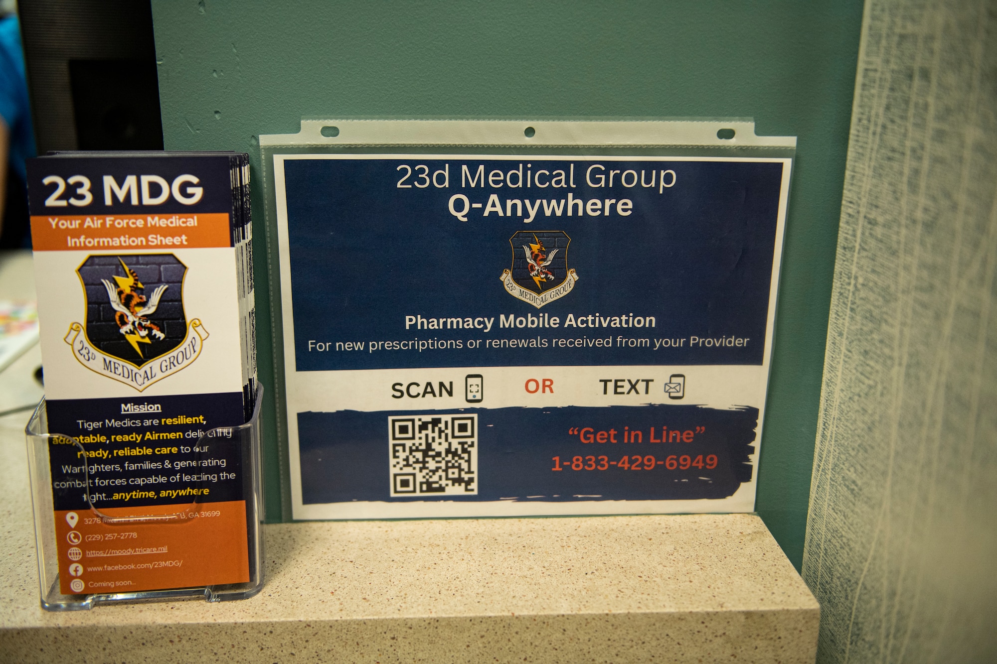 A flyer for medical group pharmacy's activation sits in the lobby