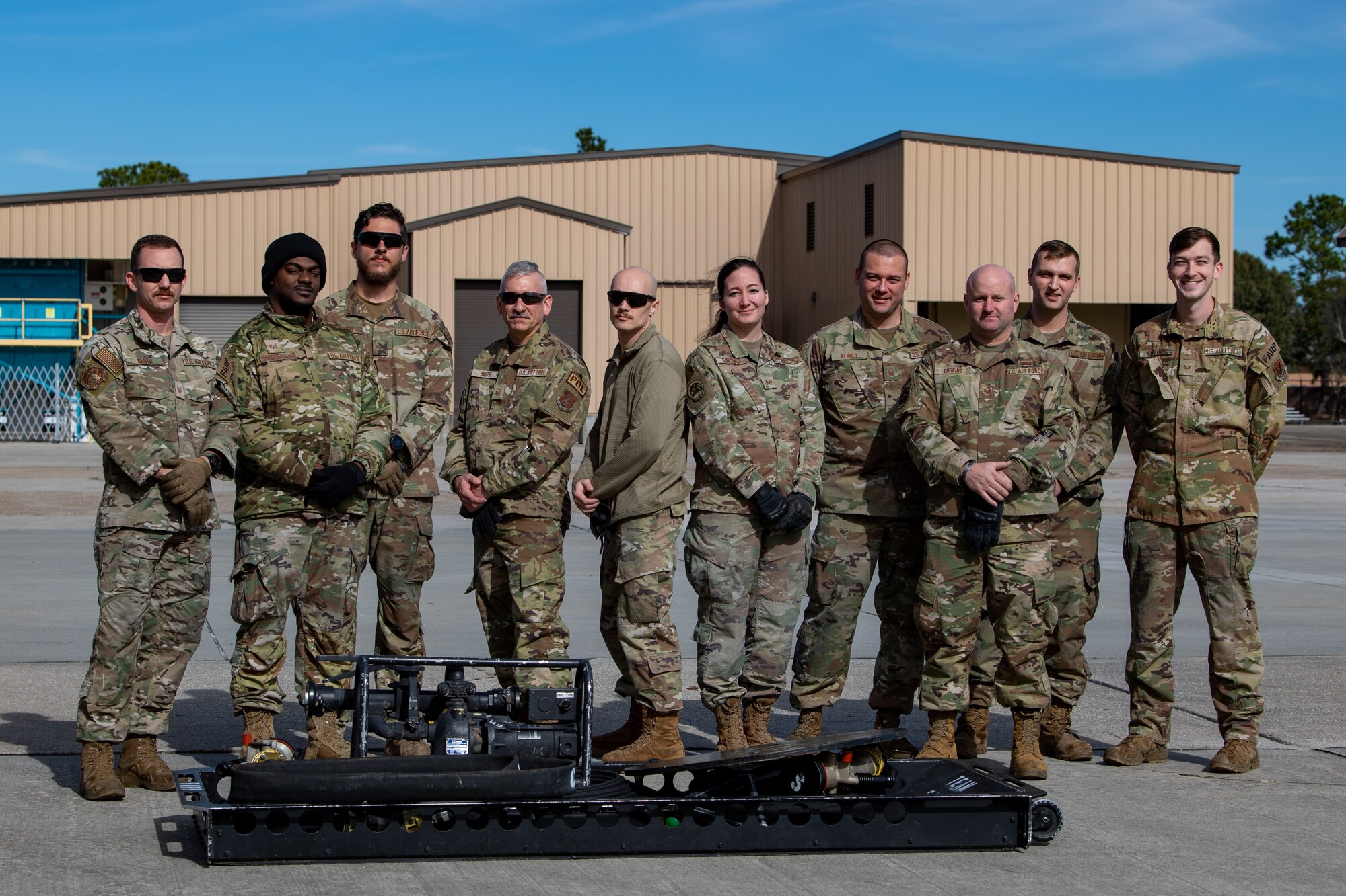 U.S. Air Force Airmen assigned to the 23rd Logistics Readiness Squadron and Guardsmen assigned to the 158th Fighter Squadron smile for a photo at Moody Air Force Base, Georgia, Dec. 12, 2023. The Guardsmen came to Moody AFB for special fuel operations familiarization. (U.S. Air Force photo by Senior Airman Courtney Sebastianelli)