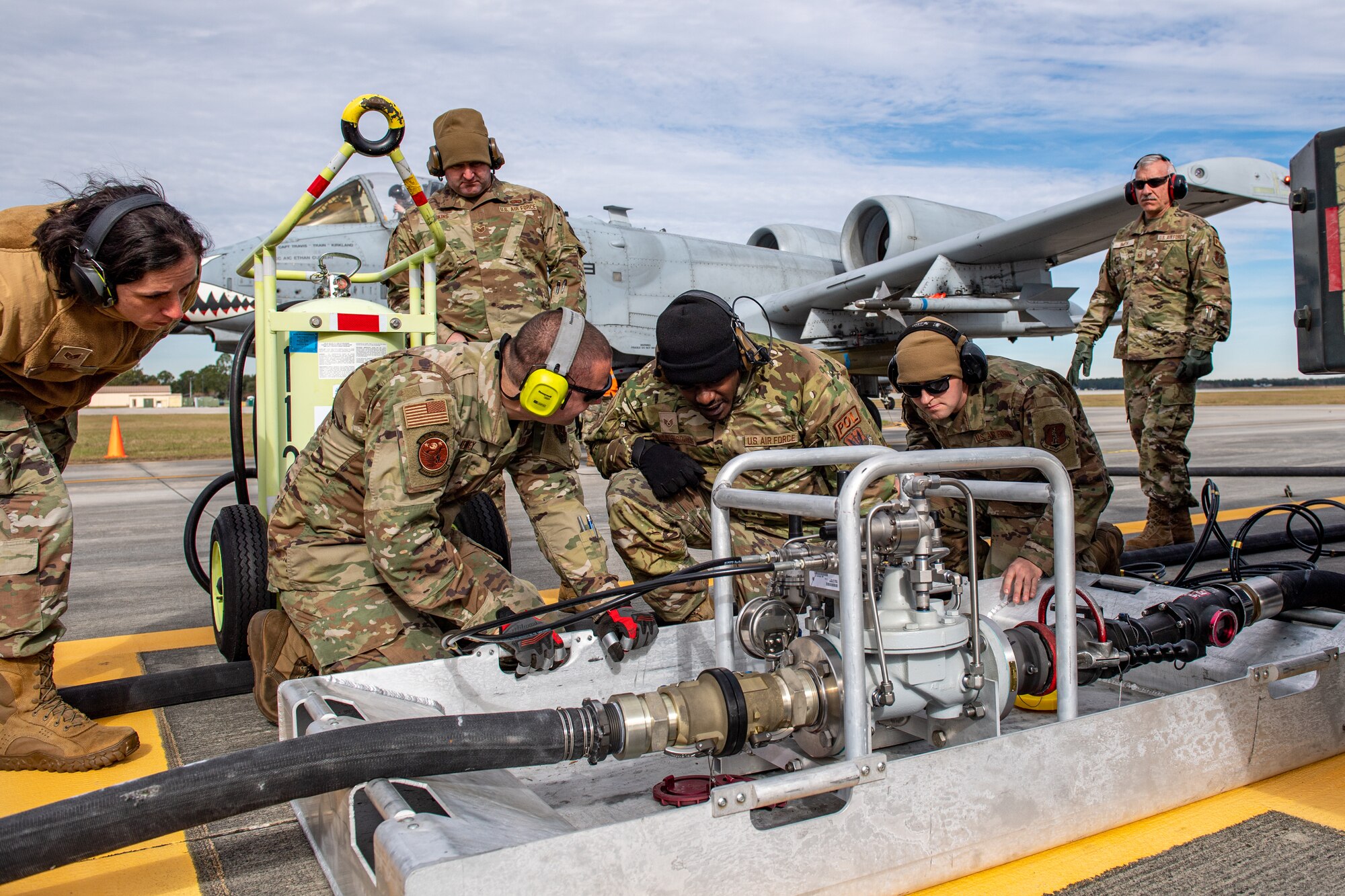 U.S. Air Force Airmen assigned to the 23rd Logistics Readiness Squadron train Guardsmen assigned to the 158th Fighter Squadron on the Versatile Integrating Partner Equipment Refueling (VIPER) kit at Moody Air Force Base, Georgia, Dec. 13, 2023. The VIPER kit is an adapter that allows hot refuel operations while an aircraft still has engines running. (U.S. Air Force photo by Senior Airman Courtney Sebastianelli)