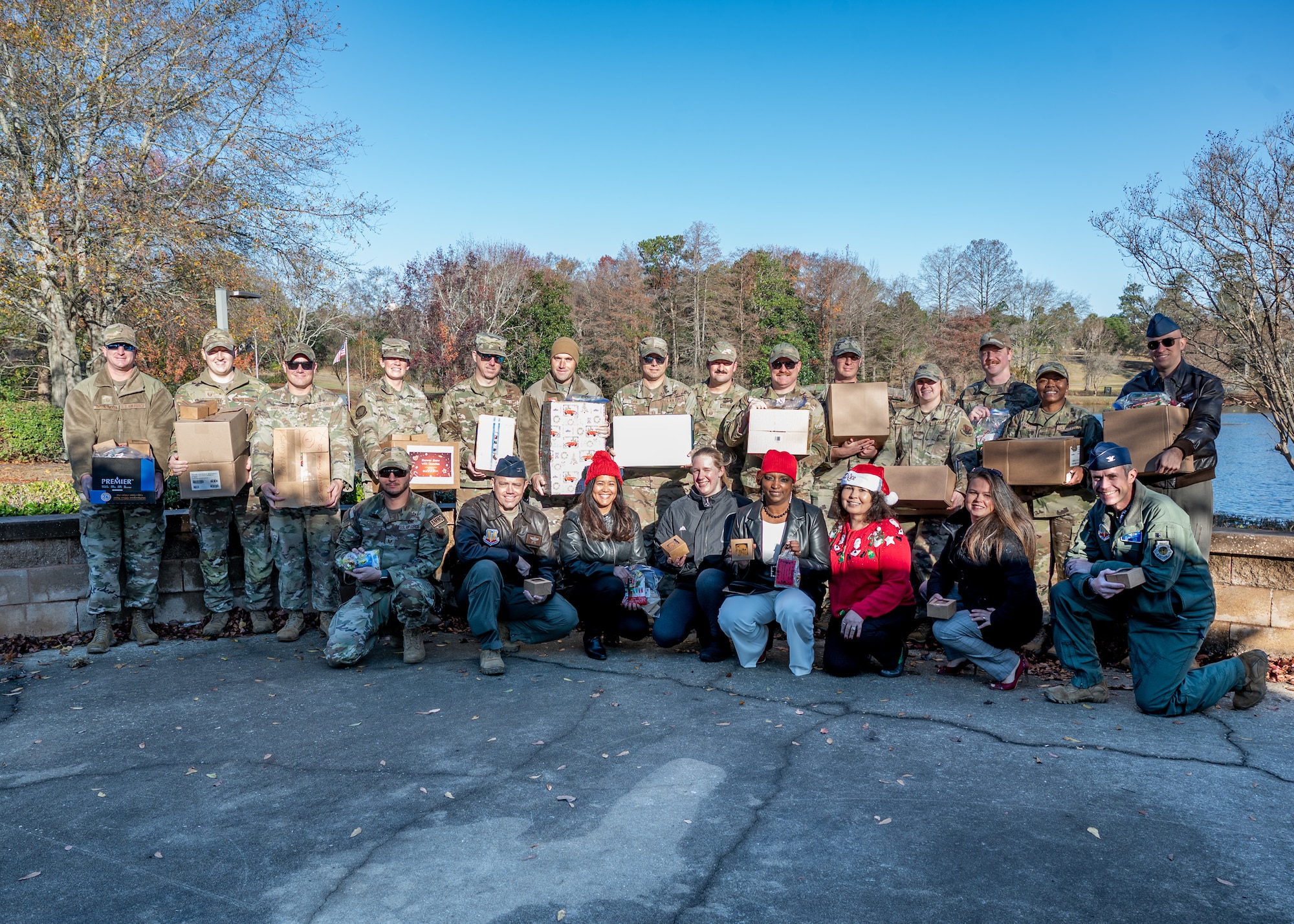 A group of men and women pose for a photo.