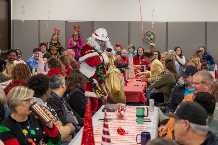 The U.S. Army Corps of Engineers (USACE) Galveston District (SWG) get a special visit during their quarterly awards ceremony Dec. 14, 2023.

Santa Claus emerged—clad in a USACE-issued hard hat—along with Bobber the Water Safety Dog, spreading holiday cheer, delivering treats, reminding every to wear their life jackets, and congratulating all the awardees and SWG employees who made this year’s “nice list.”