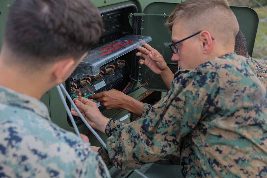 U.S. Marines with 7th Communication Battalion participate in Stand-in Force Exercise (SIFEX) 24 at Camp Hansen, Okinawa, Japan, Dec. 6, 2023. SIFEX 24 is a division-level exercise involving all elements of the Marine Air-Ground Task Force focused on strengthening multi-domain awareness, maneuver, and fires across a distributed maritime environment. This exercise serves as a rehearsal for rapidly projecting combat power in defense of all allies and partners in the region. (U.S. Marine Corps photo by Lance Cpl. Nemos Armijo)