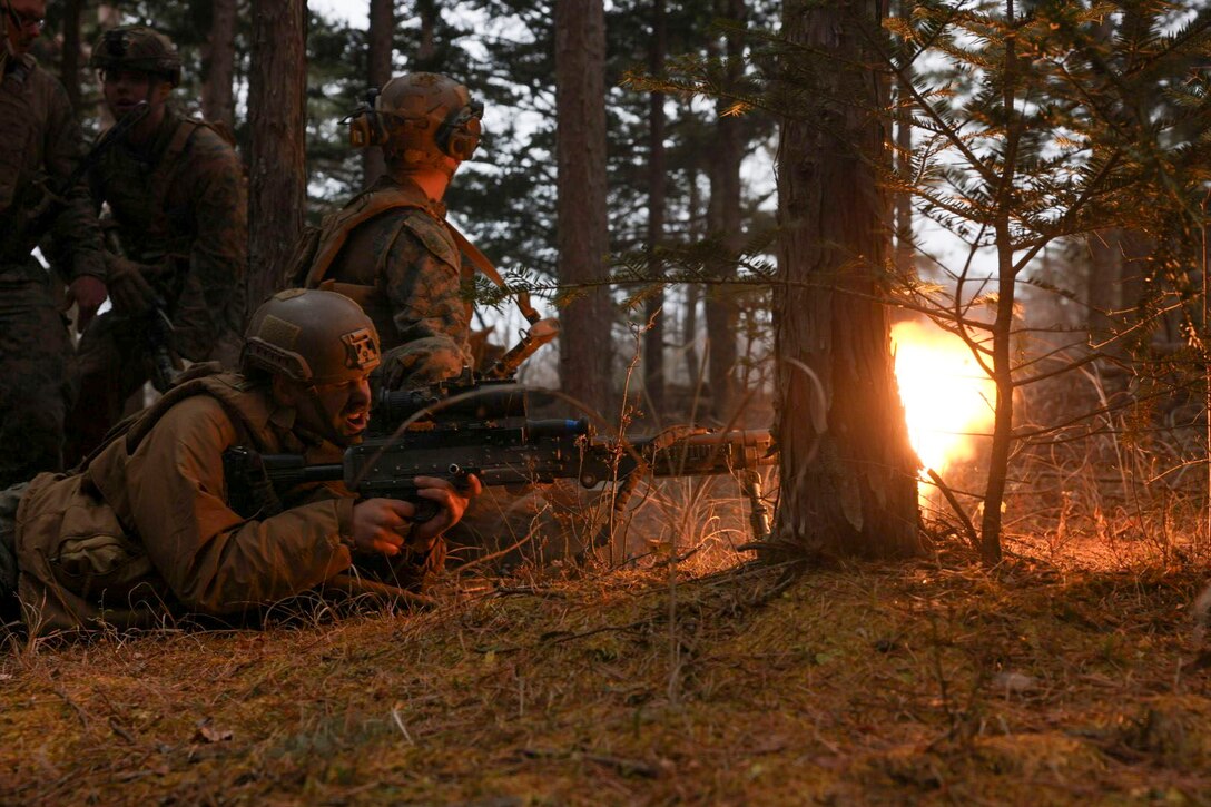 U.S. Marine Lance Cpl. Michael Bergamo fires an M240B machine gun with blank rounds during Stand-in Force Exercise 24 at Combined Arms Training Center Camp Fuji, Japan, Dec. 5, 2023. SIFEX 24 is a division-level exercise involving all elements of the Marine Air-Ground Task Force focused on strengthening multi-domain awareness, maneuver, and fires across a distributed maritime environment. This exercise serves as a rehearsal for rapidly projecting combat power in defense of allies and partners in the region. Bergamo, a native of Dexter, Michigan, is an antitank missile gunner with 2d Battalion, 2d Marines. 2/2 is forward deployed in the Indo-Pacific under 4th Marine Regiment, 3d Marine Division as part of the Unit Deployment Program. (U.S. Marine Corps photo by Cpl. Michael Taggart)