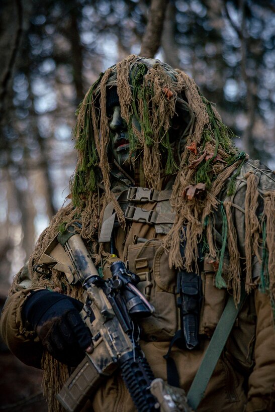 A U.S. Marine executes a reconnaissance mission during Stand-In Force Exercise 24 at Combined Arms Training Center Camp Fuji, Japan, Dec. 2, 2023. SIFEX 24 is a division-level exercise involving all elements of the Marine Air-Ground Task Force focused on strengthening multi-domain awareness, maneuver, and fires across a distributed maritime environment. This exercise serves as a rehearsal for rapidly projecting combat power in defense of allies and partners in the region. The Marine is with 3d Reconnaissance Battalion, 3d Marine Division. (U.S. Marine Corps photo by Lance Cpl. Matthew Morales)