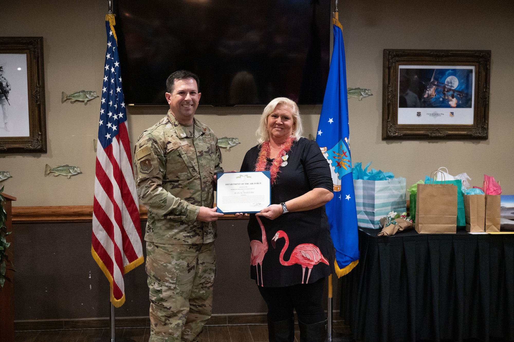Col. Brent Greer, 27th Special Operations Wing Deputy Commander, presents Jean Masters, Cannon Air Force Base Sexual Assault Response Coordinator, with a civilian service award, Dec. 6, 2023, at the Landing Zone, Cannon AFB, N.M. Masters has been the Cannon AFB SAPR Coordinator since early 2008, and has taken a position at the 1st Special Operations Wing, Hurlburt Field, Fla., as the Equal Opportunity Director. (U.S. Air Force photo by Senior Airman Alexcia Givens)
