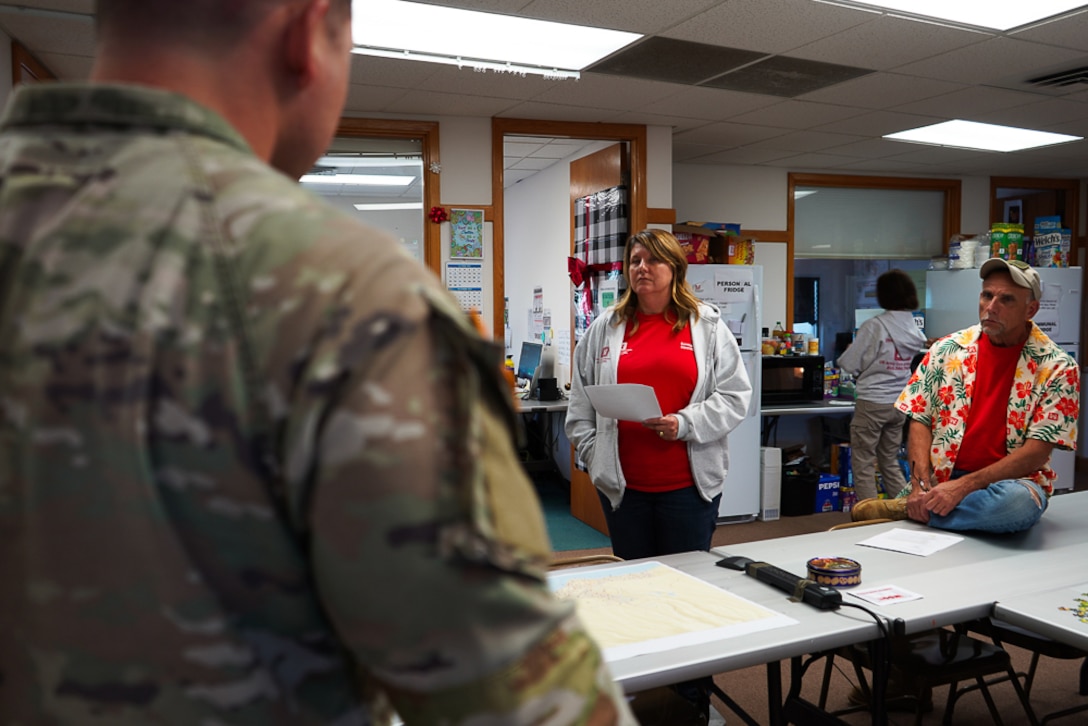 At the U.S. Army Corps of Engineers, Recovery Field Office, U.S. Army Cpt. Kyle C. Fleming briefs the emergency management operations chief, Sarah Jones, and her deputy, Jerry Breznican, on working through the preparation for the Rehersal of Concept (ROC).