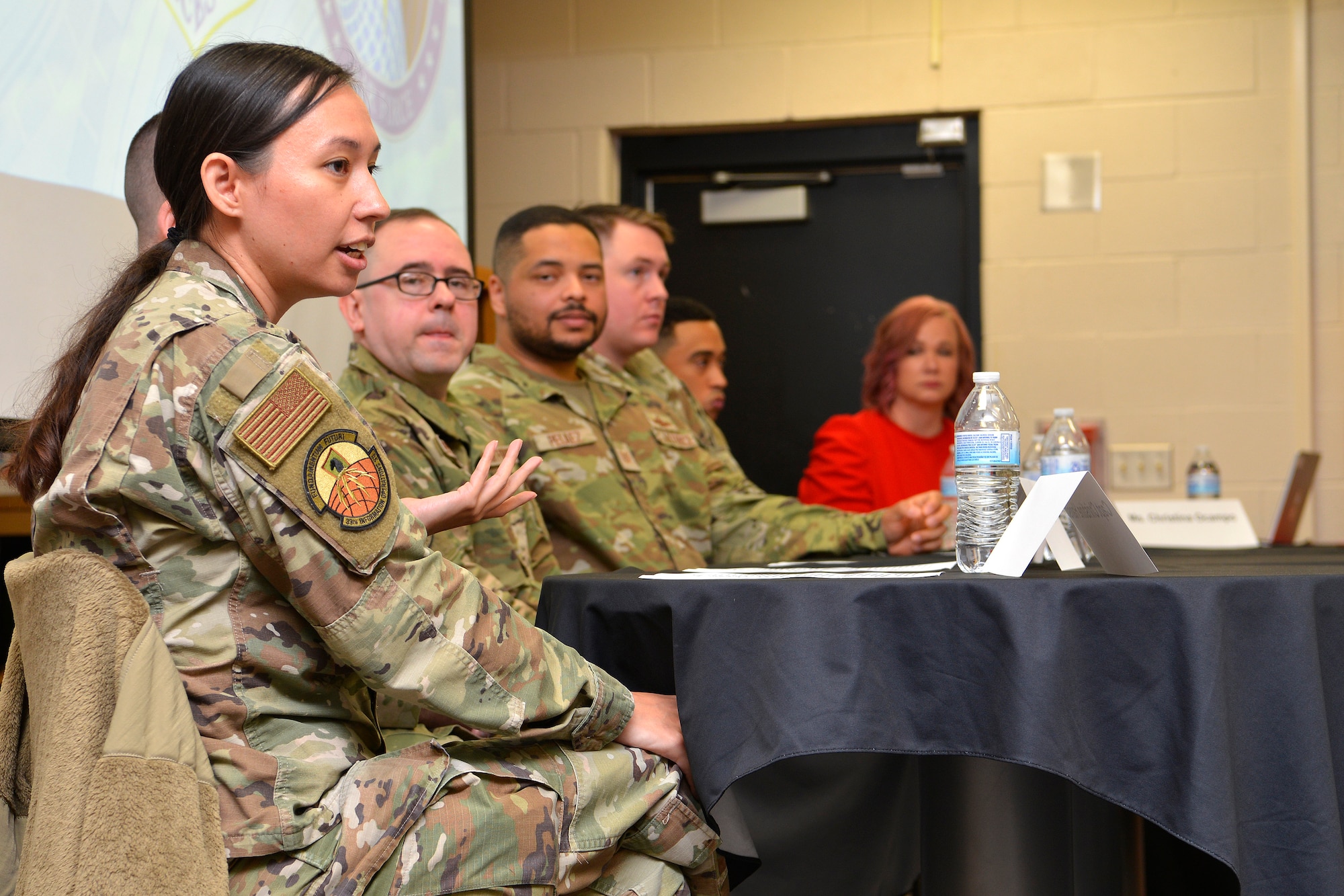 Airmen speak to students in the school's library.