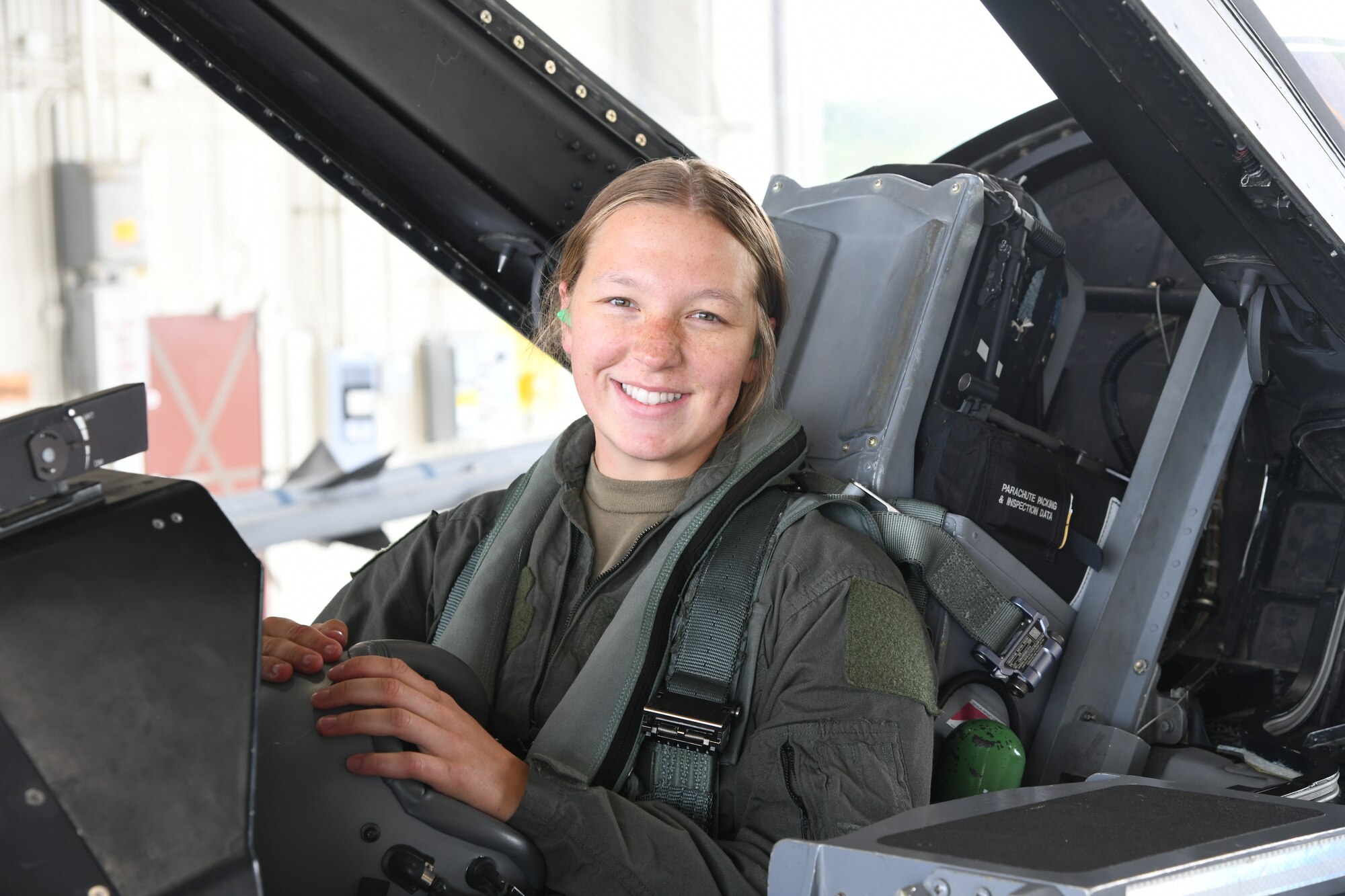 Traffic Management Specialist, Senior Airman Mallory Sunnarborg, smiles after receiving an F-16 familiarization flight on August 11, 2023.