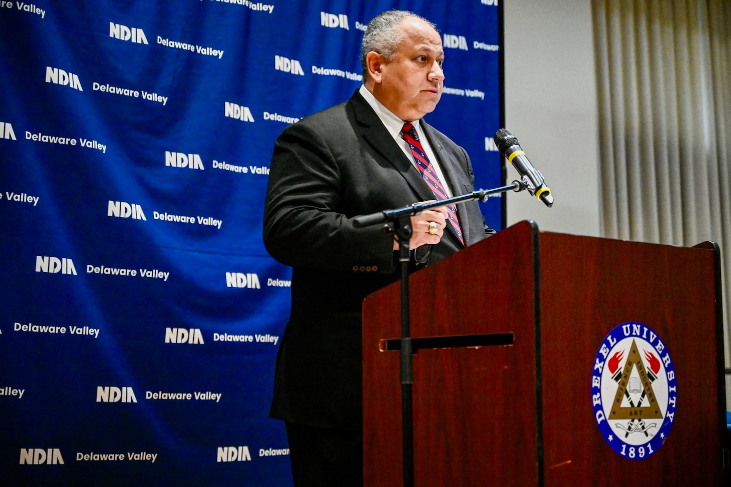 Secretary of the Navy Carlos Del Toro delivers remarks at the NDIA Delaware Valley Chapter (NDIA-DVC) Naval Nuclear Submarine and Aircraft Carrier Suppliers’ Conference at Drexel University, Dec. 14. During the third annual conference, Secretary Del Toro urged industry and academia to join efforts to restore the Nation’s competitive shipbuilding and repair landscape.