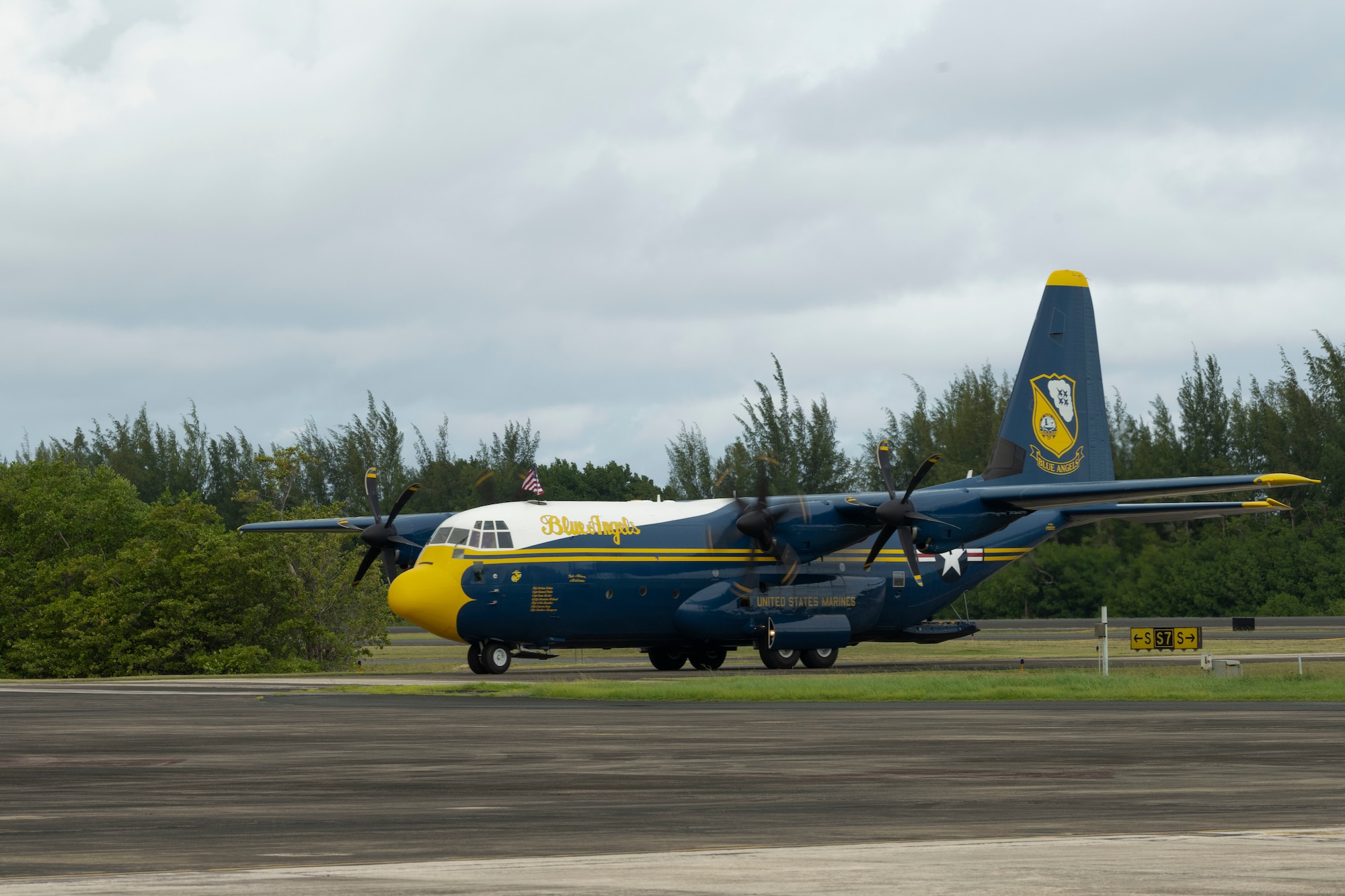 A C-130J Super Hercules “Fat Albert” assigned to the U.S. Navy Flight Demonstration Squadron, the Blue Angels, arrives at the 156th Wing airfield, Muñiz Air National Guard Base, Carolina, Puerto Rico, Dec. 15 2023. The Puerto Rico Air National Guard supported the U.S. Navy Blue Angels in a campaign with Toys for Tots, which impacted communities across the Island in an effort to distribute more than 20,000 toys to local children during the holiday season. (U.S. Air National Guard photo by Airman 1st Class Victoria Jewett)