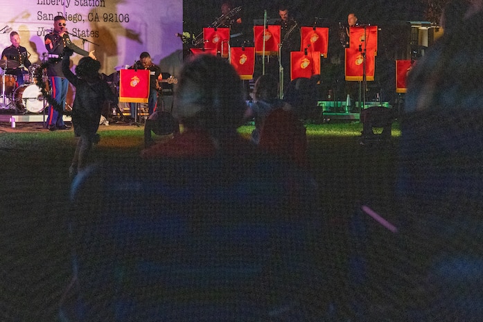 U.S. Marine Corps Staff Sgt. Adam Chandler, vocalist of Marine Band San Diego, sings during the 2023 holiday concert at Liberty Station in San Diego, Dec. 9, 2023. The concert is annual and featured Marine musicians performing a variety of holiday classics and seasonal favorites. The Marine Corps Bands inspire patriotism and represent American values through music. Chandler is from Wilmington, North Carolina.  (U.S. Marine Corps photo by Staff Sgt. Melissa L. Karnath)