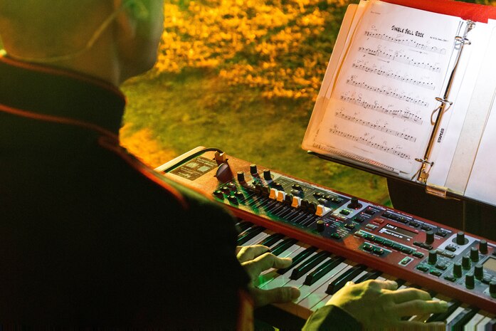 A U.S. Marine Corps musician of Marine Band San Diego plays the piano during the 2023 holiday concert at Liberty Station in San Diego, Dec. 9, 2023. The concert is annual and featured Marine musicians performing a variety of holiday classics and seasonal favorites. The Marine Corps Bands inspire patriotism and represent American values through music. (U.S. Marine Corps photo by Staff Sgt. Melissa L. Karnath)